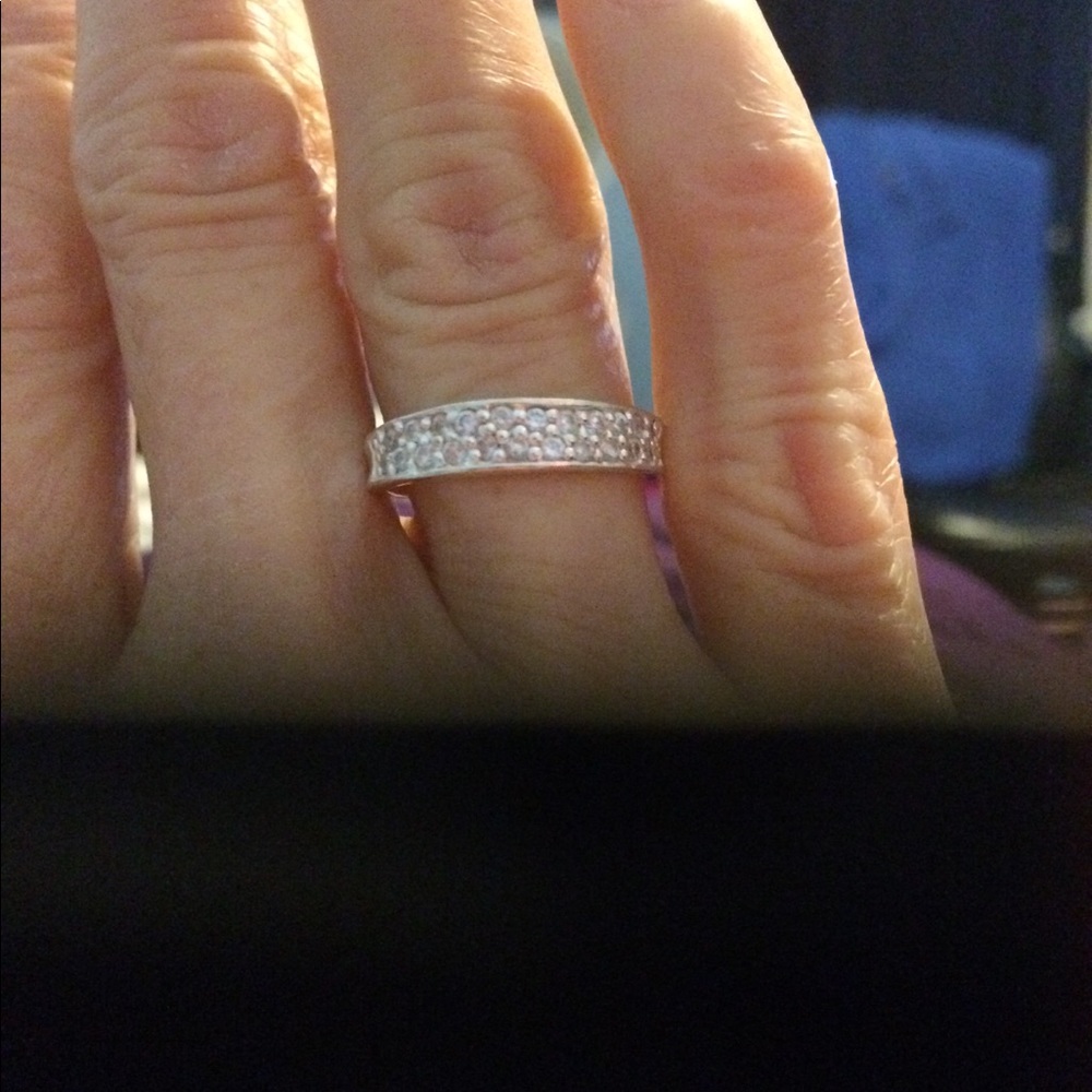 Sterling silver band with cz on band.
